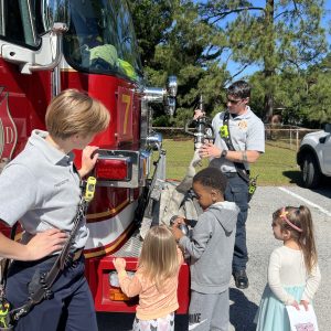 kids at front of firetruck