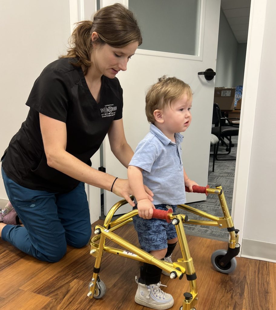 Jenn Jones, PT, DPT, PCS working with physical therapy rehabilitation therapy client