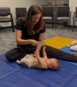 PT Jenn Jones at Savannah Speech & Hearing C enter helping baby learn to crawl
