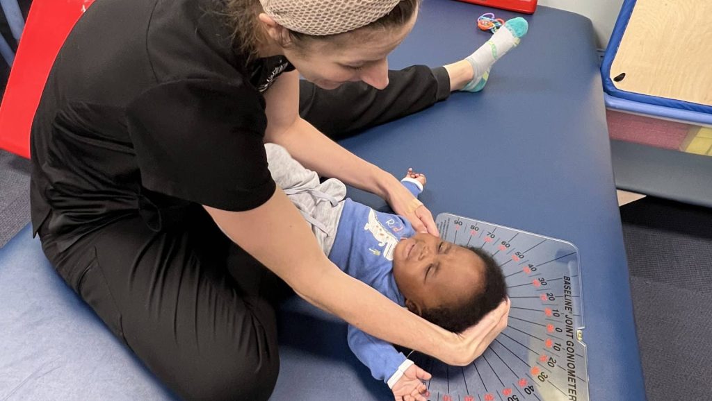 Jennifer Jones PT, DPT, PCS | Board Certified Pediatric Clinical Specialist and Pediatric Physical Therapist performing torticollis screening at Savannah Speech and Hearing Center