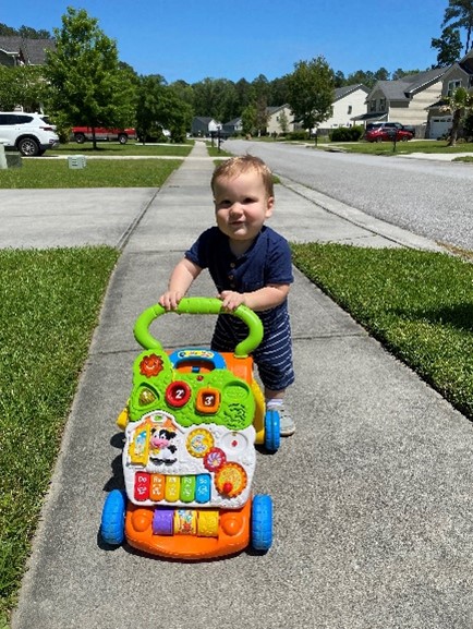 Little boy with walking toy