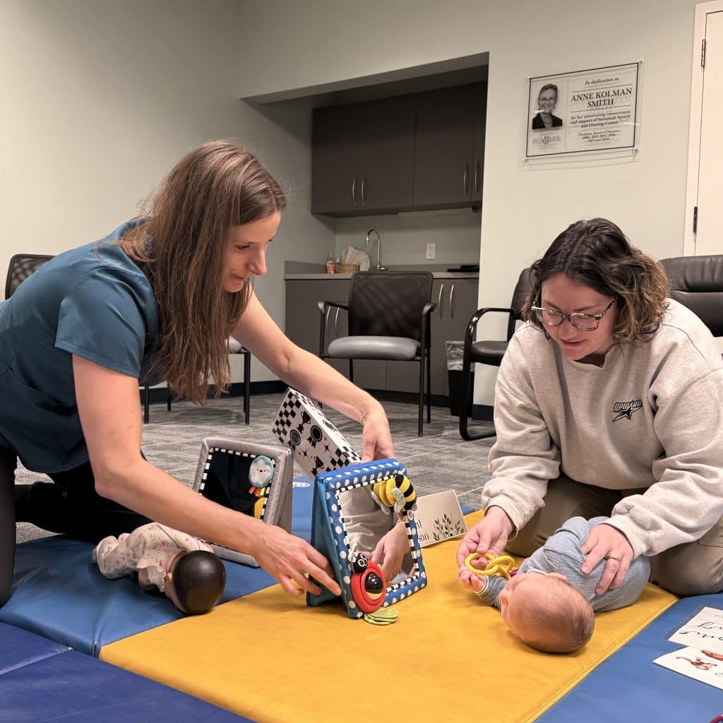 Jenn Jones, Pediatric PT at Savannah Speech & Hearing Center offers mom and baby help with Tummy Time using mirror
